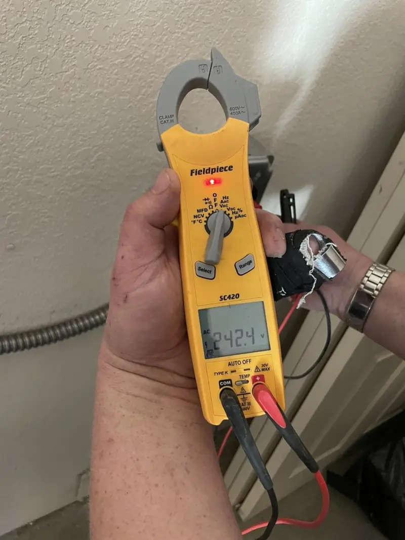 Voltage testing with clamp meter during Outlet Installation in Cohoctah